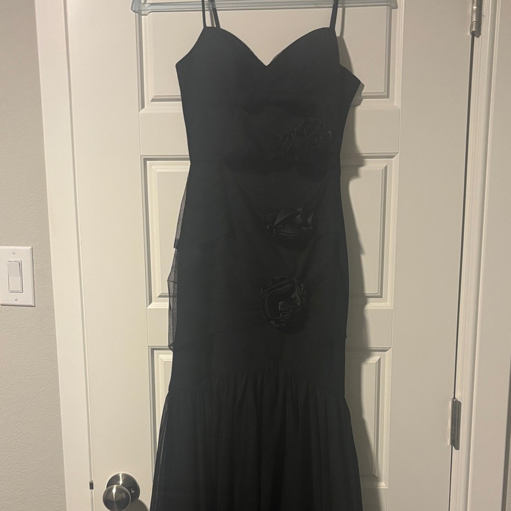 Beautiful black mermaid cut formal dress. Cutouts